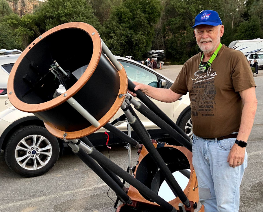 CCAS astronomer with a large telescope